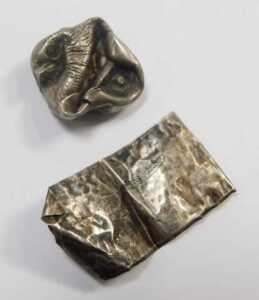 A group of white metal mounts, walking canes, cheroots, bottle tops, and an enamel butterfly... - 5