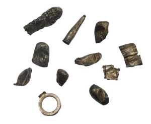A group of white metal mounts, walking canes, cheroots, and bottle tops, 1.35oz. (AF)