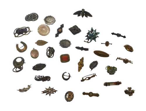 A group of costume brooches, mainly period examples, to include gilt metal, memorial, crested,...