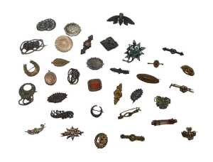 A group of costume brooches, mainly period examples, to include gilt metal, memorial, crested,...