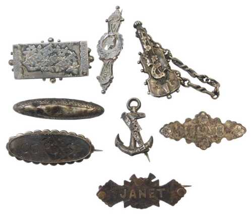 Eight silver brooches, to include a sweetheart brooch, named brooches for Nelly and Janet, and a...