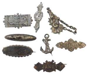 Eight silver brooches, to include a sweetheart brooch, named brooches for Nelly and Janet, and a...
