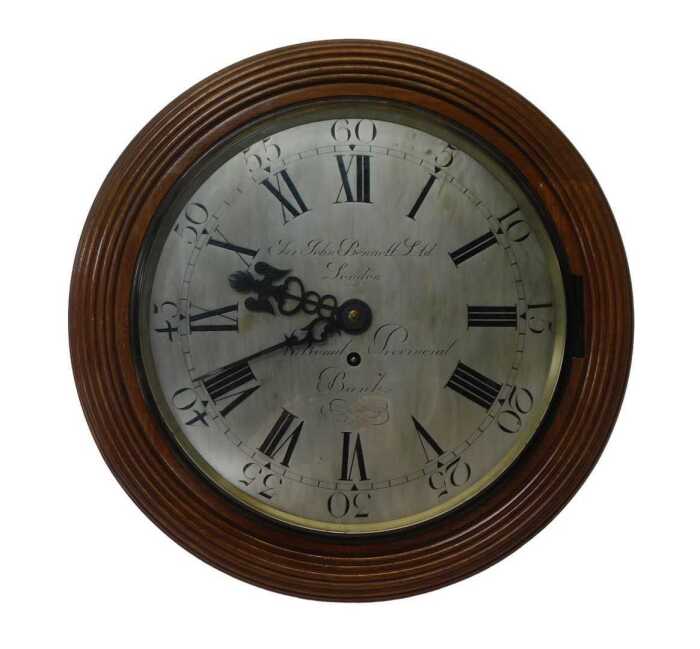 An early 20thC oak cased single fusee wall clock by Sir John Bennett Ltd, for the London...