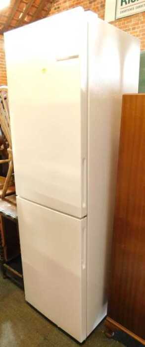 A Bosch fridge/freezer, white, 182cm high, 55cm wide, 56cm deep.