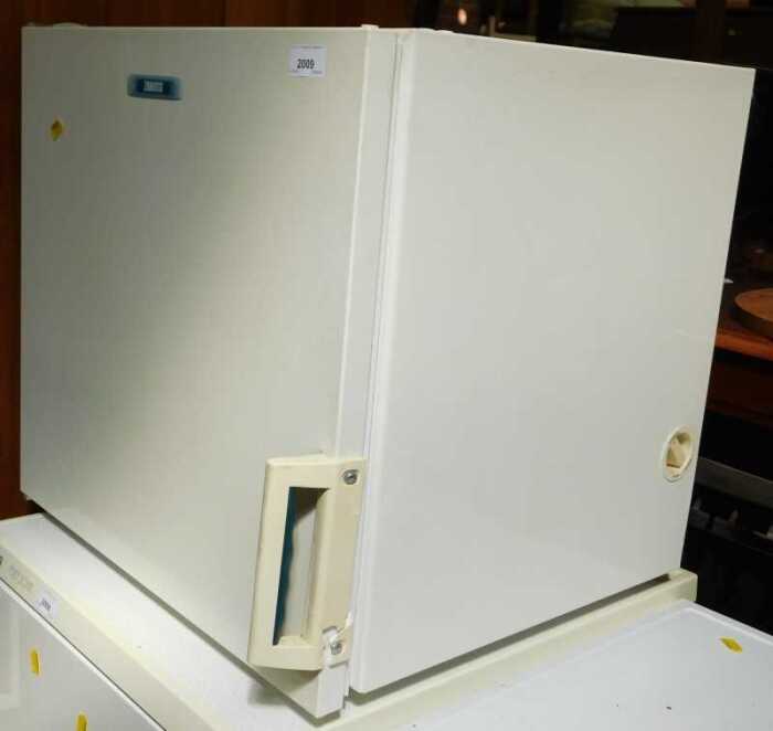 A Zanussi countertop freezer, white.