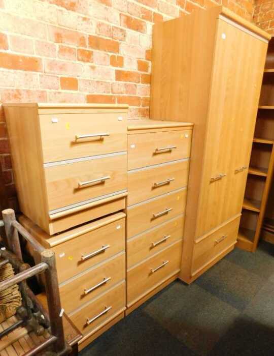 A contemporary bedroom suite, comprising a two-door wardrobe with a single drawer to base, 190cm...