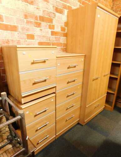 A contemporary bedroom suite, comprising a two-door wardrobe with a single drawer to base, 190cm...