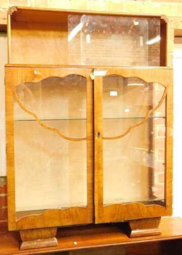 A walnut display cabinet.
