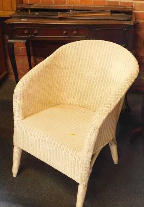 An Edwardian dressing table, with mirror back to gallery, (AF), and a Lloyd Loom style chair...