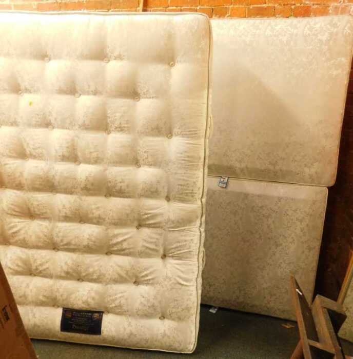 A double divan bed, comprising a pocket spring Millbrook mattress, a divan base with drawers.