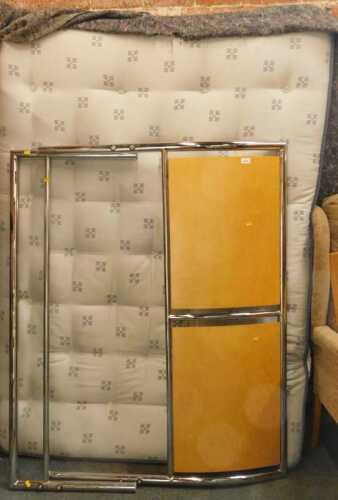 A double bed, comprising headboard, tailboard, mattress, and slatted wooden base.