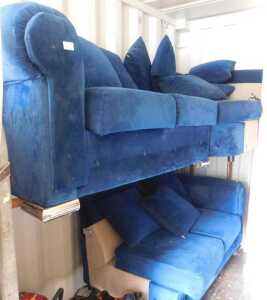 A contemporary blue draylon upholstered L shaped sofa, raised on chromed supports, 226cm x 222cm.