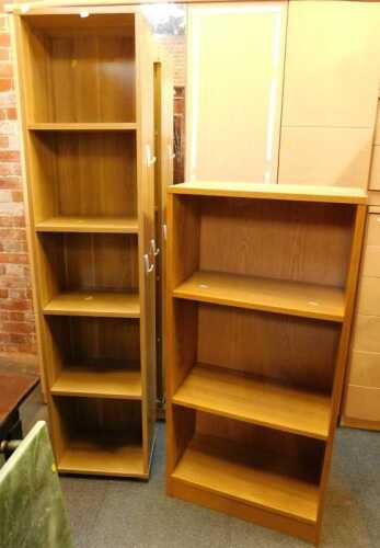 Two bookcases, one with five shelves, one with three shelves, finished in wood effect.