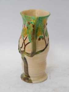 A Carltonware relief moulded jug, decorated with an oak tree with acorns, against a buff ground,... - 2