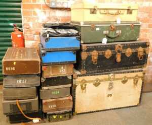 Trunks and laundry cases, to include a large metal bound trunk, finished in white, a large black...