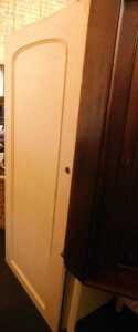 A section of a Victorian mahogany wardrobe, enclosing two drawers below four slides, later...
