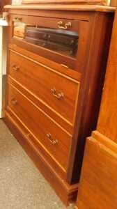 A 20thC mahogany television cabinet, the top with a moulded edge, above a glass fronted fall...