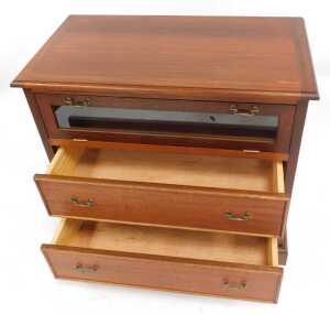 A 20thC mahogany television cabinet, the top with a moulded edge, above a glass fronted fall... - 2