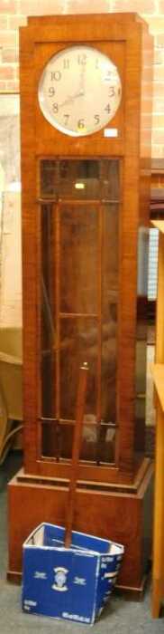 A 1920s walnut cased longcase clock, the circular silvered dial with Arabic numerals, with...