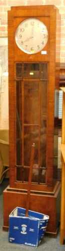 A 1920s walnut cased longcase clock, the circular silvered dial with Arabic numerals, with...