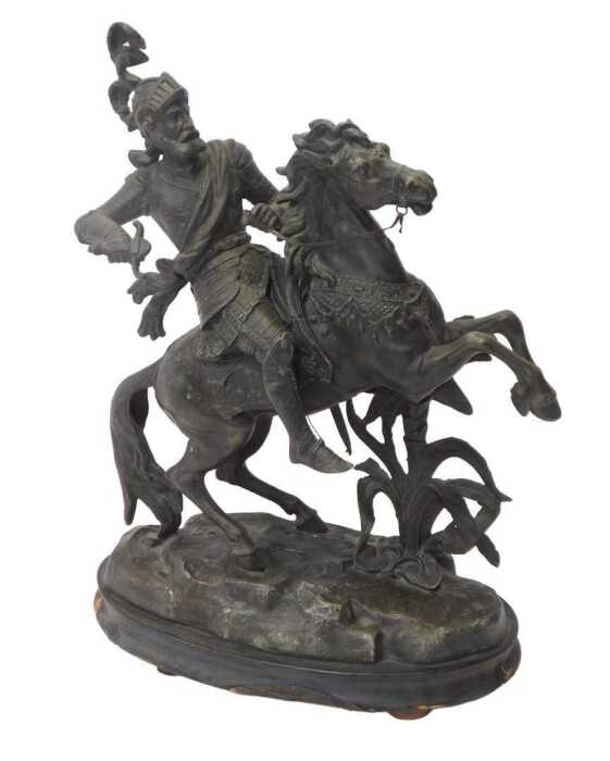 A 19thC spelter figure, modelled as an armoured figure on rearing horseback, raised on an...