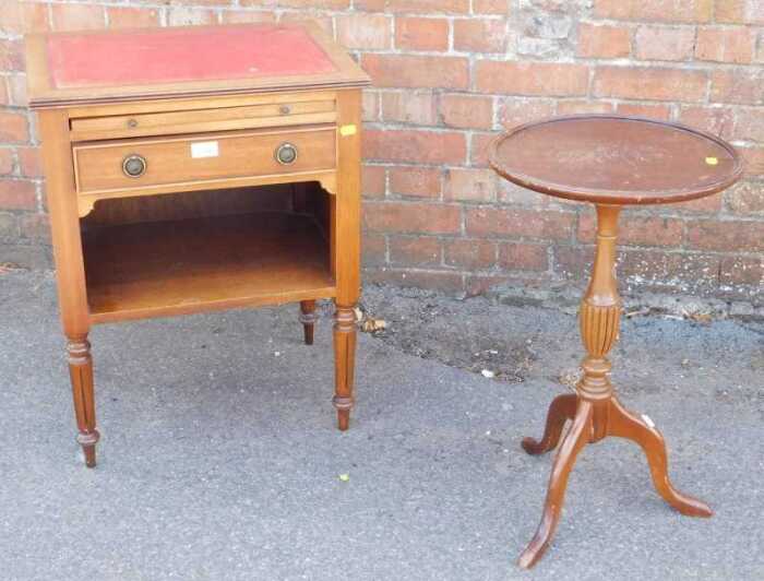 A wine table, circular topped, raised on tripod base, a small oak cabinet with tooled leather...