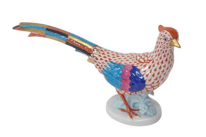 A Herend porcelain figure modelled as a pheasant, raised on an oval base, printed marks, 17cm high.