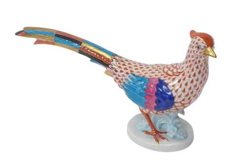 A Herend porcelain figure modelled as a pheasant, raised on an oval base, printed marks, 17cm high.