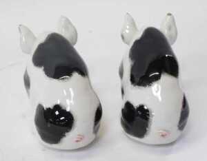 A pair of Wemyss pottery black spotted pigs, in seated position, signed, 9.5cm high. (AF) - 3