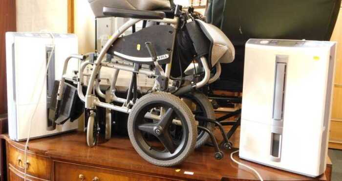 Two Mitsubishi dehumidifiers, model number MJ-E16VX, and a folding wheelchair by Karma, S-Ergo...