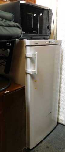 A Liebherr upright freezer, finished in white, and a Panasonic inverter oven. (2)