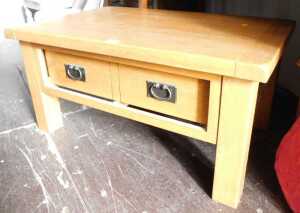 A contemporary oak coffee table, with single frieze drawer, raised on square legs, 44cm high,...