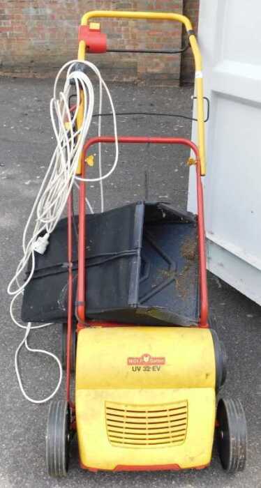 A Wolf Garten electric lawn scarifier.