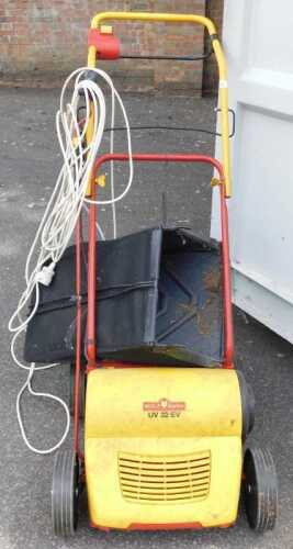 A Wolf Garten electric lawn scarifier.