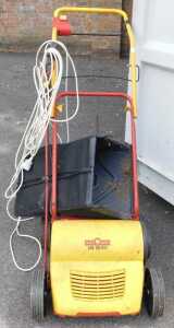 A Wolf Garten electric lawn scarifier.