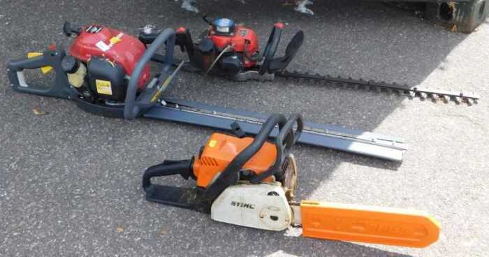 A Honda petrol hedge cutter, together with a Golden Star petrol hedge trimmer, HT-670, and a...