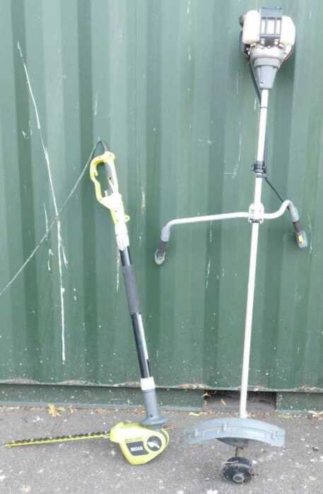 A Honda petrol strimmer, together with a Ryobi electric hedge cutter. (2)