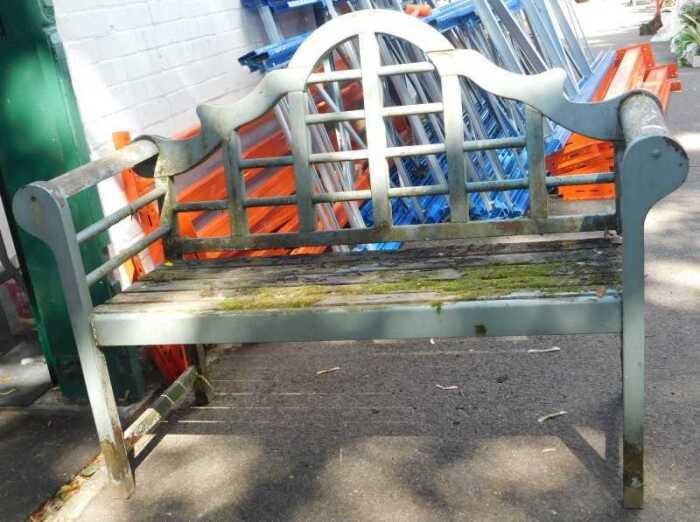 A painted wooden garden bench, with turned back and slatted seat, 136cm wide. (AF)