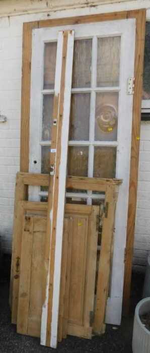 A 2x8 six panel wooden door, together with a painted wooden and multi glass pane door, further...