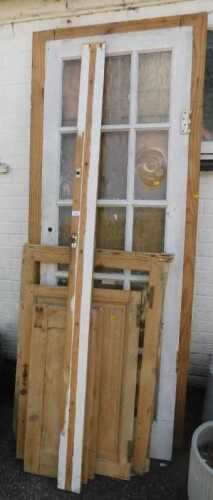A 2x8 six panel wooden door, together with a painted wooden and multi glass pane door, further...