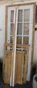 A 2x8 six panel wooden door, together with a painted wooden and multi glass pane door, further...
