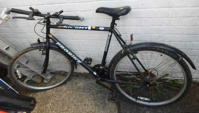 A Shimano Pro Bike Black Knight bicycle, in black trim.