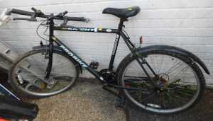 A Shimano Pro Bike Black Knight bicycle, in black trim.