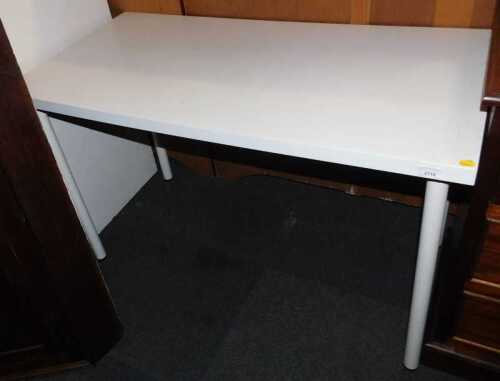 An Ikea Linnmon Adils white table, with adjustable legs, 73cm high, 120cm wide x 60cm deep.
