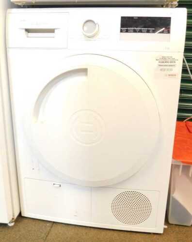 A Bosch Series 4 under-counter tumble dryer, in white.