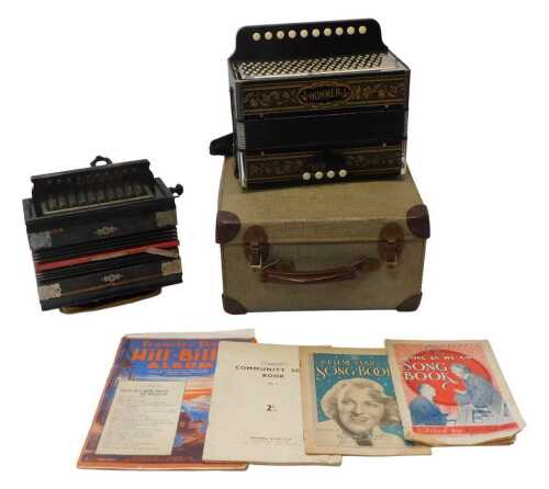 A Hohner ten-button accordion, 28cm wide, cased, together with The Victor Antoria ten-button...