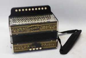 A Hohner ten-button accordion, 28cm wide, cased, together with The Victor Antoria ten-button... - 2