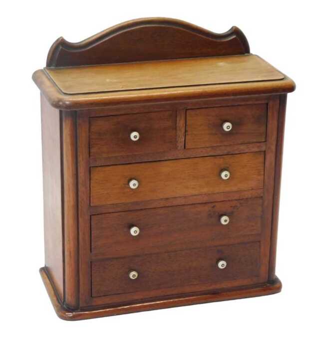 A Victorian mahogany apprentice chest, the top with a raised back above two short and three long...
