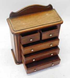 A Victorian mahogany apprentice chest, the top with a raised back above two short and three long... - 2
