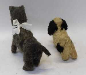 A group of early 20thC straw filled soft toys, comprising a blonde jointed Teddy bear, 39cm high,... - 2